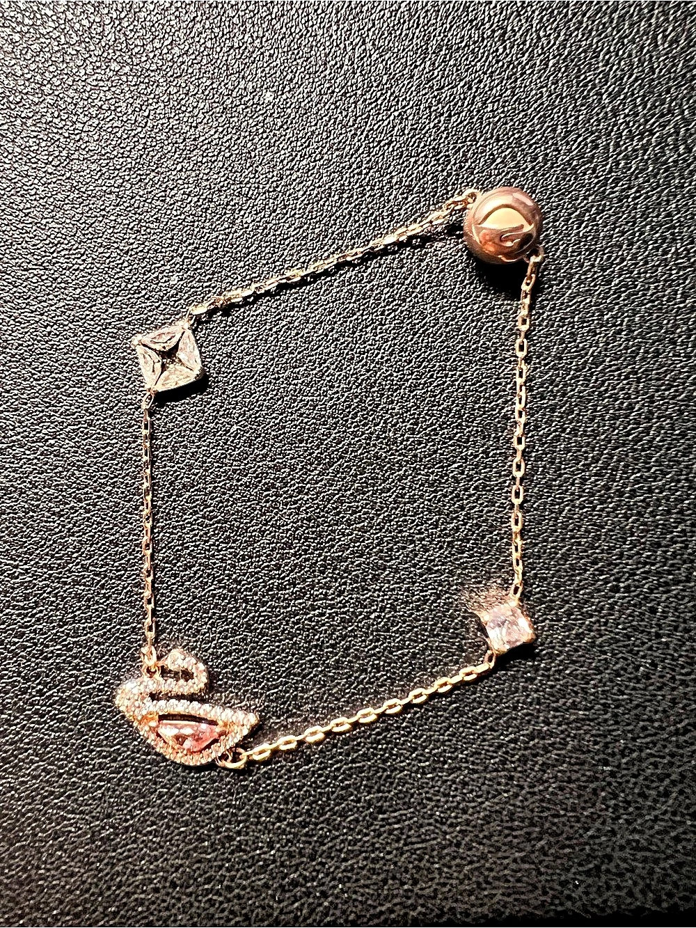 Swarovski Dazzling Swan Bracelet in Gold & Pink